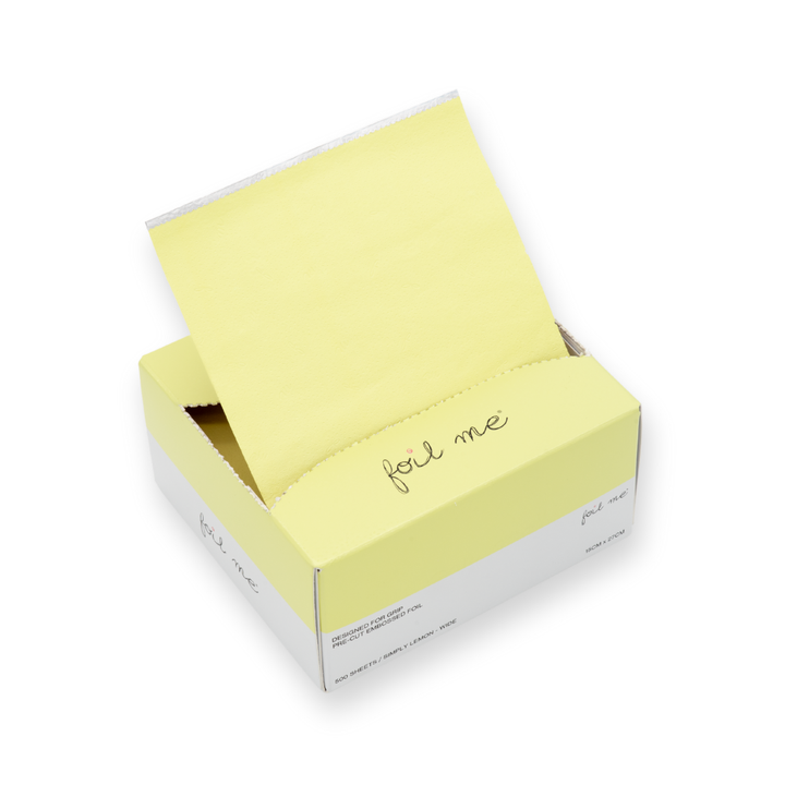 A box of pre-cut butter yellow hair foil sheets with a label that reads 'foil me', designed for use in hair color, balayage and high lights