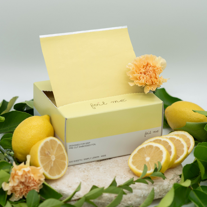 A box of pre-cut butter yellow hair foil sheets with a label that reads 'foil me', designed for use in hair color, balayage and high lights